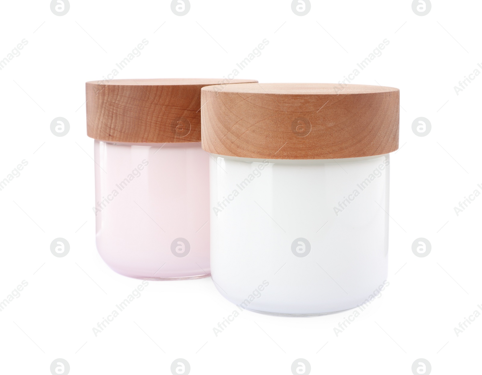 Photo of Jars of face cream isolated on white