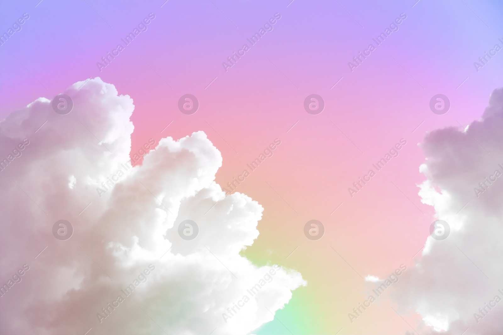 Image of Fantasy world. Picturesque view of beautiful magic sky with fluffy clouds, toned in pastel rainbow or unicorn colors