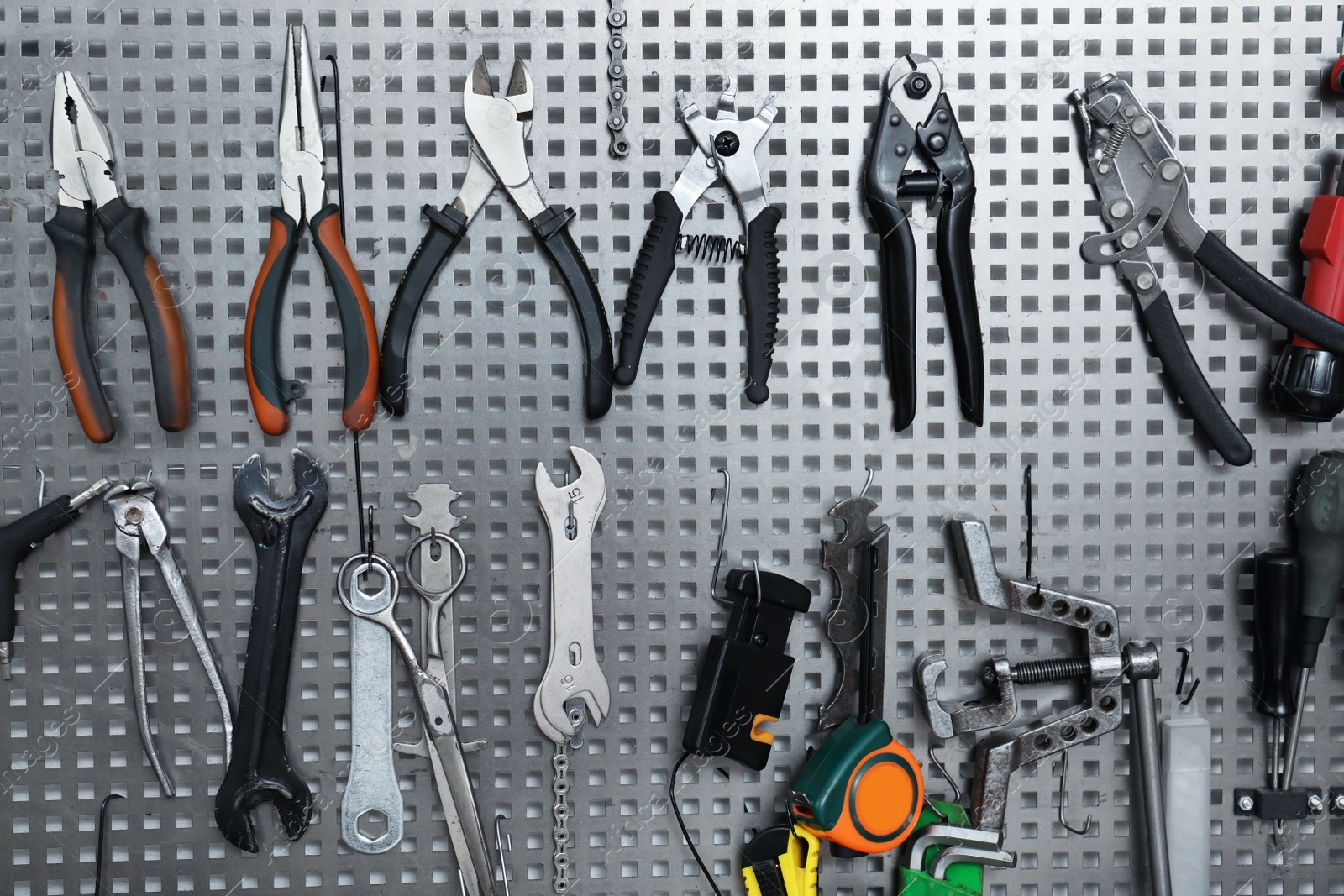 Photo of Set of different tools for bicycle repairing on stand