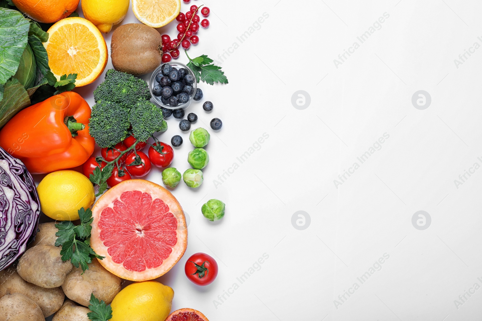 Photo of Different products rich in vitamin C on white background, top view