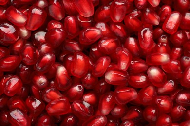 Tasty pomegranate seeds as background, top view