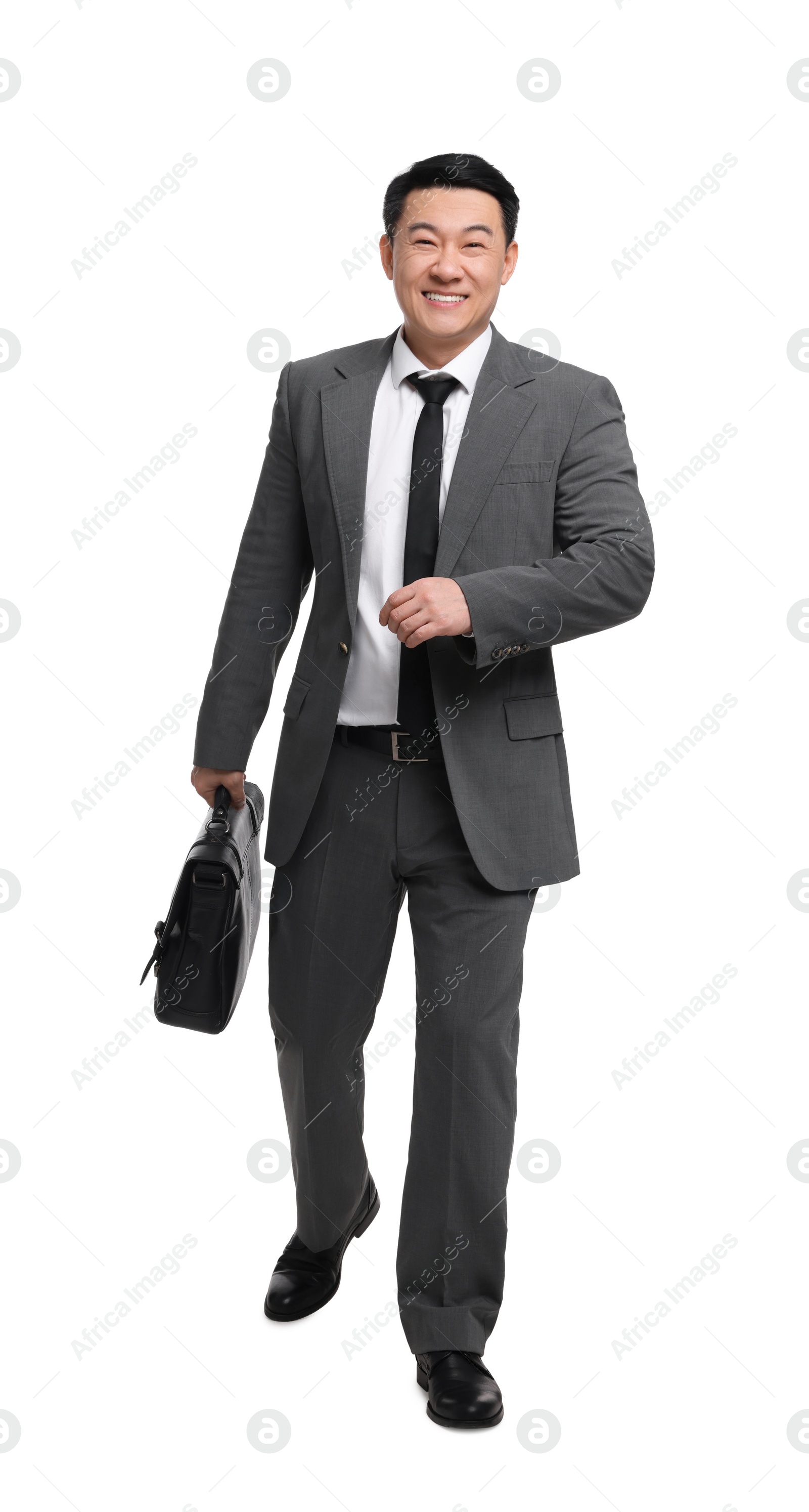 Photo of Businessman with briefcase walking on white background