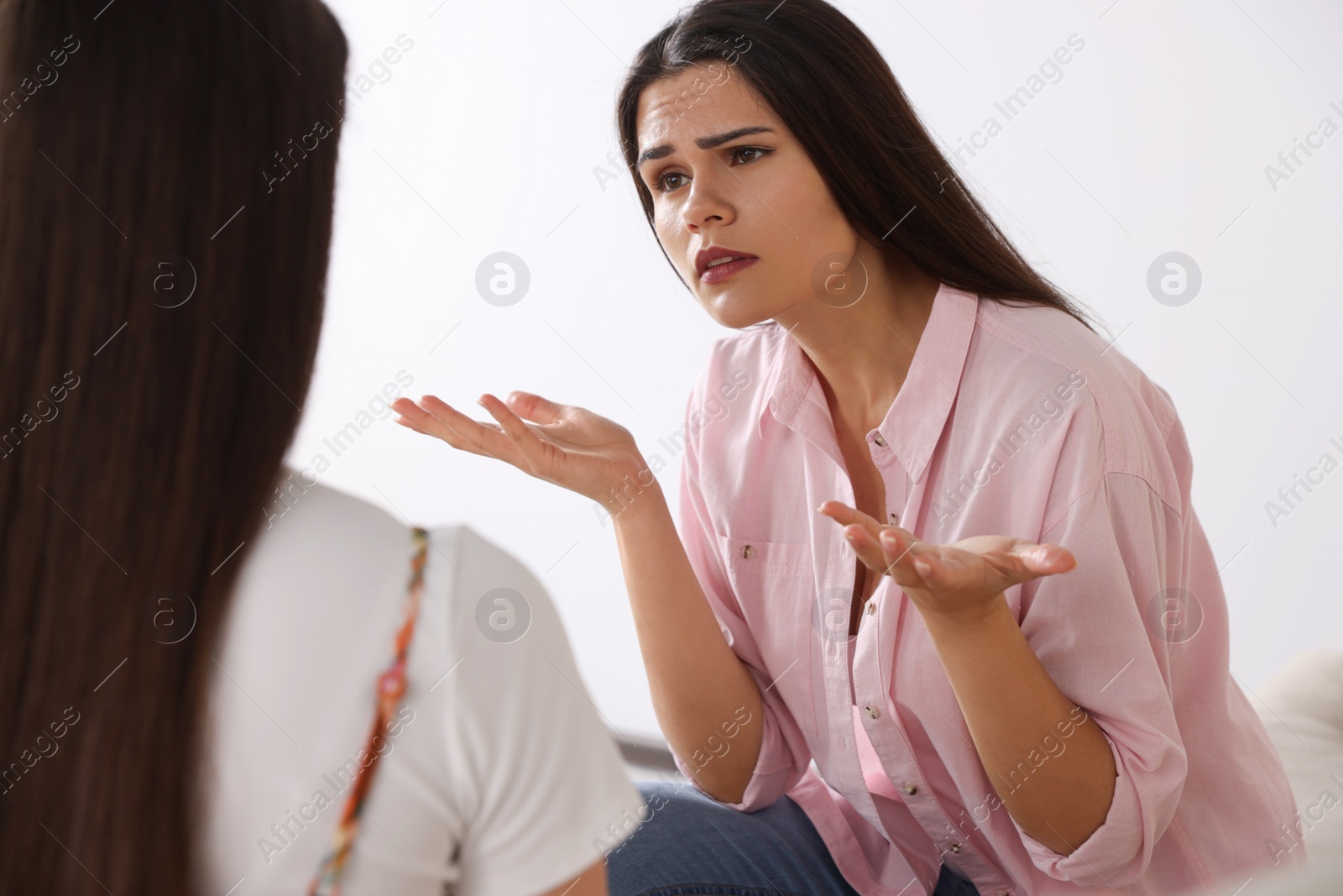 Photo of Professional psychologist working with young woman in office