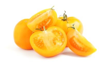 Photo of Cut and whole yellow tomatoes on white background