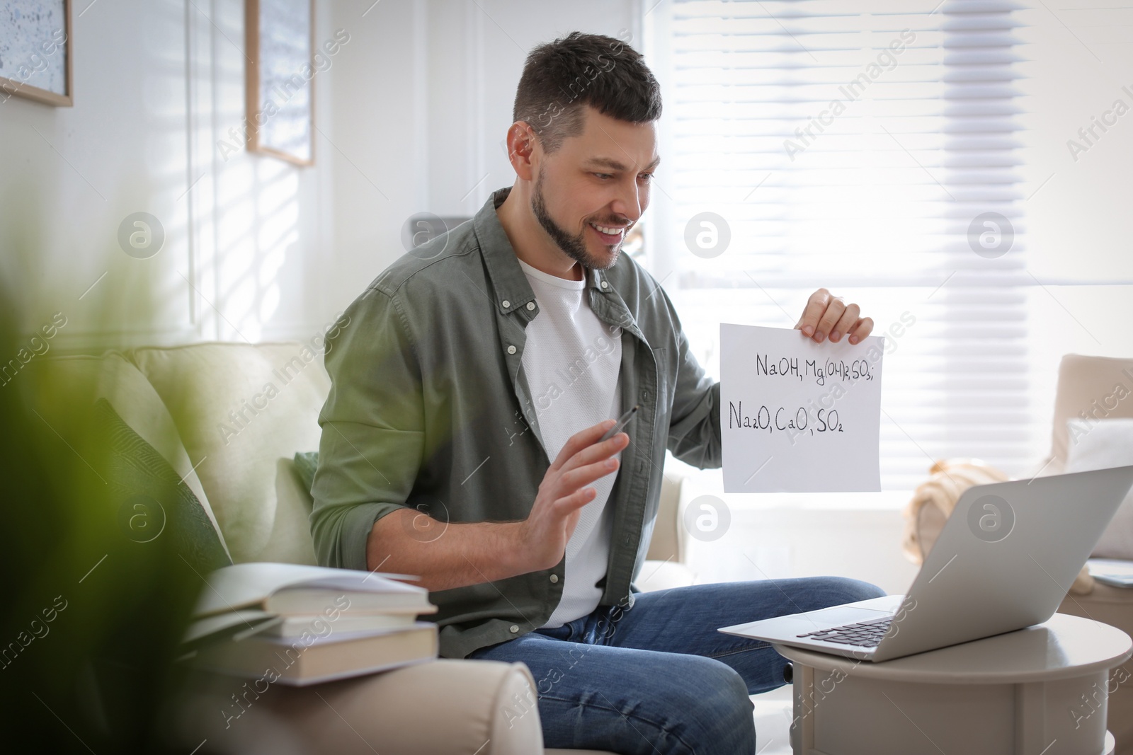 Photo of Teacher conducting online lesson at home during COVID-19 quarantine