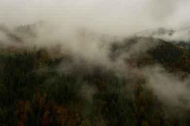 Aerial view of mountains covered with fog