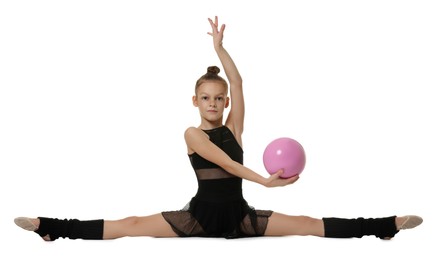 Photo of Cute little gymnast with sitting on side split against white background