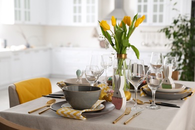 Photo of Beautiful Easter table setting with festive decor indoors