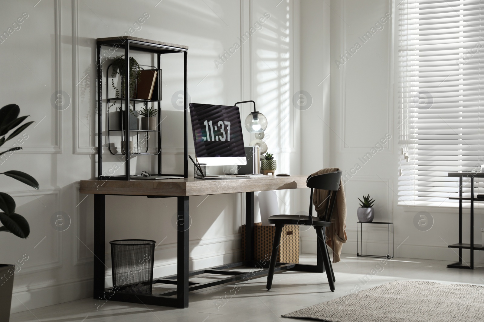 Photo of Room interior with comfortable workplace. Modern computer on wooden desk