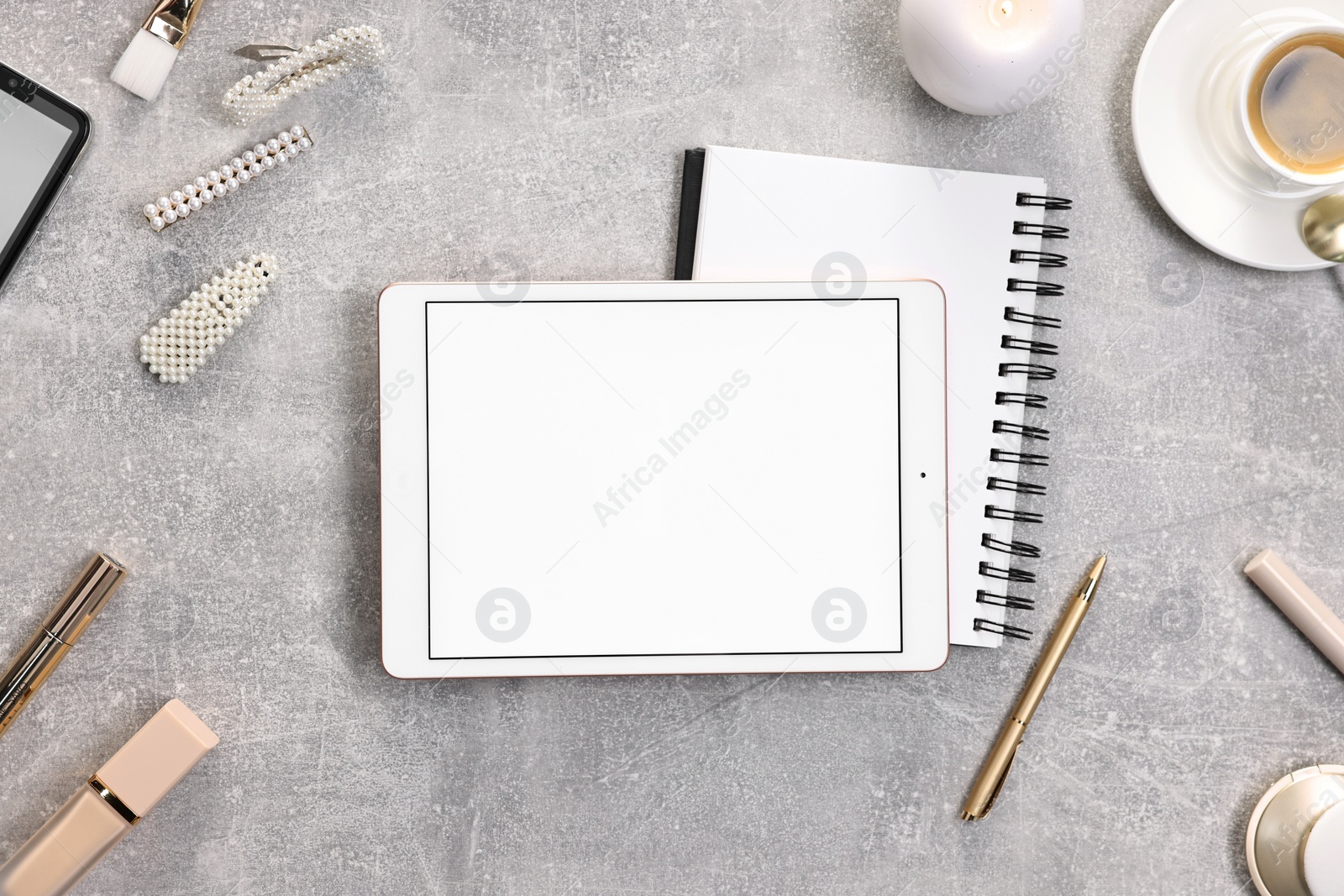 Photo of Flat lay composition with modern tablet on light grey table. Space for text