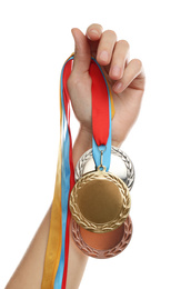 Photo of Woman holding medals on white background, closeup. Space for design