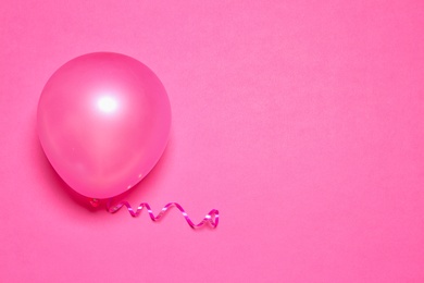 Photo of Bright balloon on color background, top view with space for text. Party time