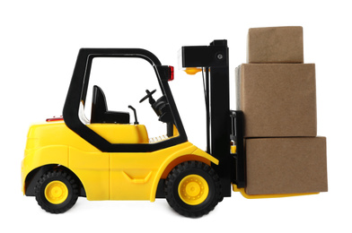 Toy forklift with boxes isolated on white. Logistics and wholesale concept