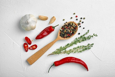 Flat lay composition with different aromatic spices on light background