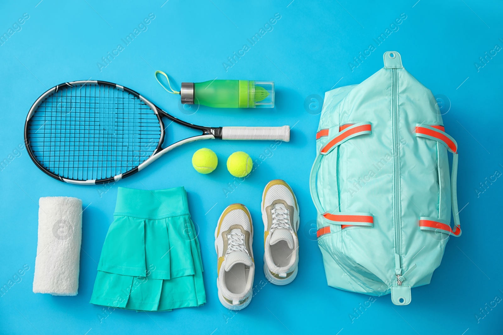 Photo of Flat lay composition with sports bag on light blue background