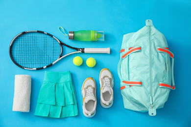 Flat lay composition with sports bag on light blue background