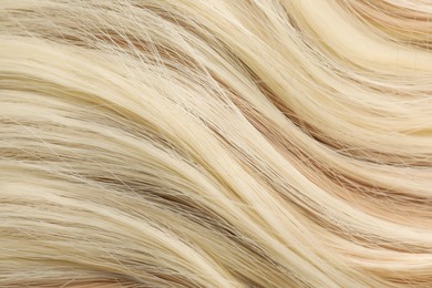 Photo of Beautiful blonde hair as background, closeup view