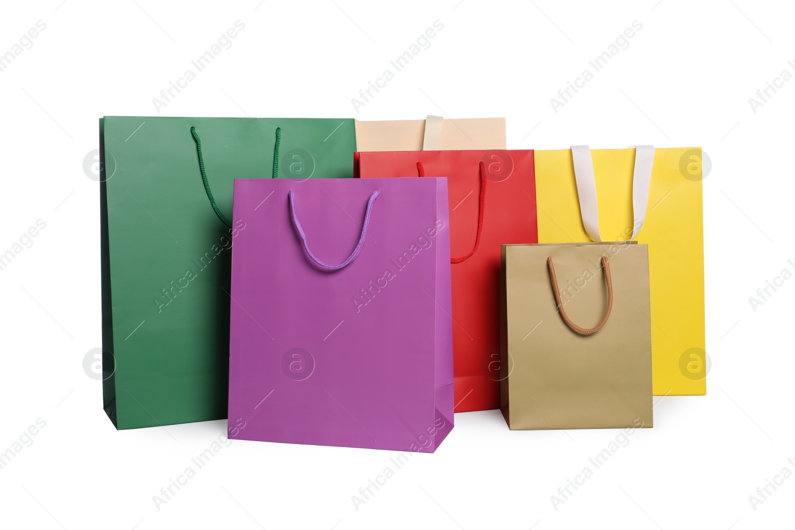 Photo of Colorful paper shopping bags isolated on white