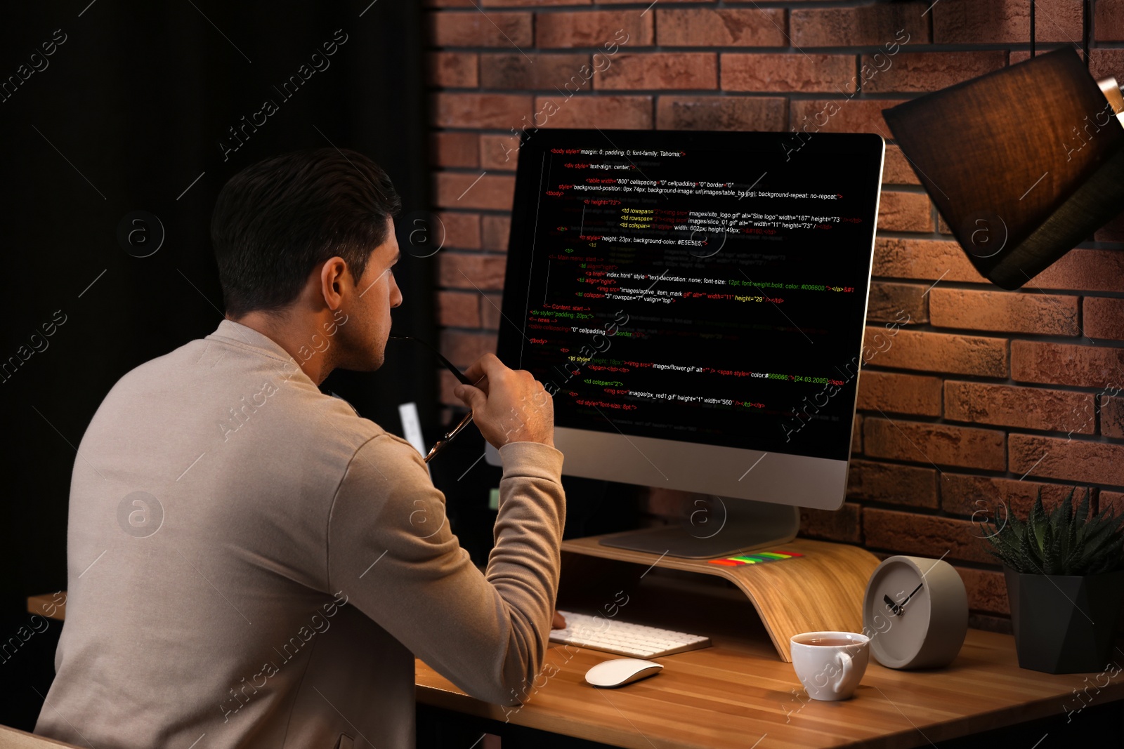 Image of Professional programmer working with computer in office