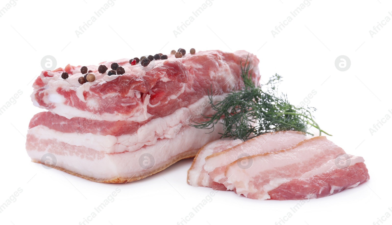 Photo of Pieces of pork fatback with dill and spices isolated on white