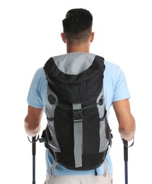 Male hiker with backpack and trekking poles on white background, back view