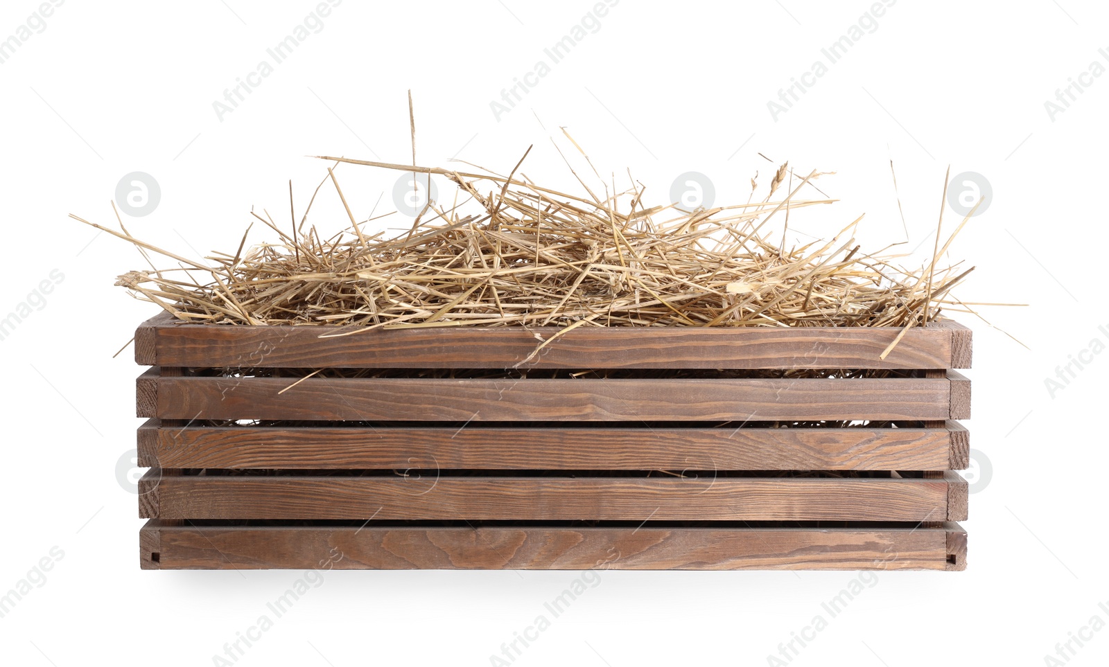 Photo of Dried straw in wooden crate isolated on white