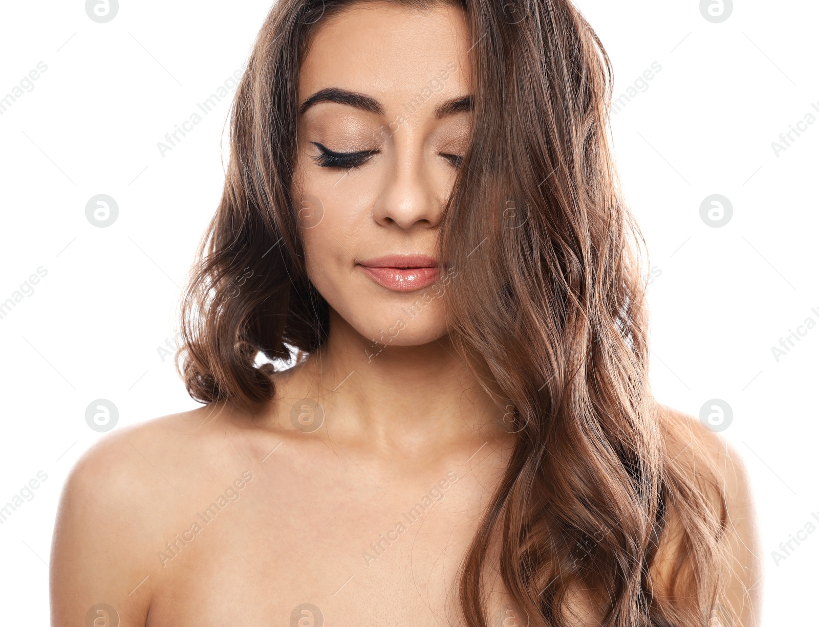 Photo of Beautiful woman with shiny wavy hair on white background