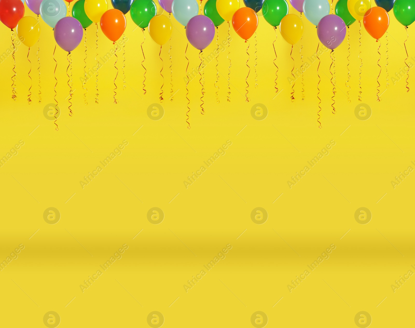 Image of Set of color balloons on yellow background. Space for text