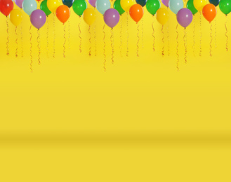 Image of Set of color balloons on yellow background. Space for text