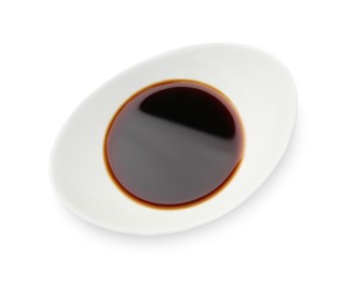 Photo of Tasty soy sauce in gravy boat isolated on white, top view