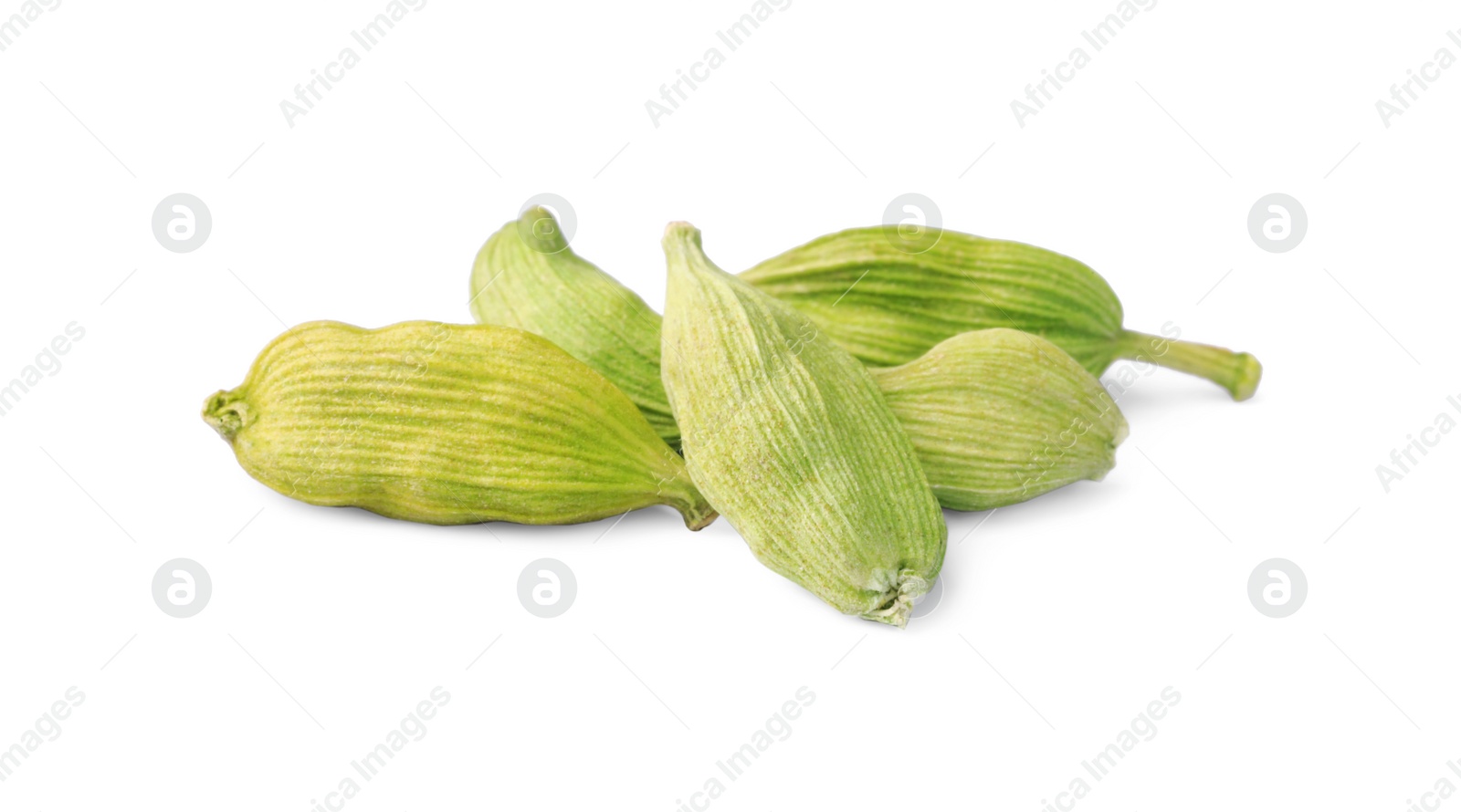 Photo of Pile of dry green cardamom on white background