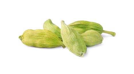 Photo of Pile of dry green cardamom on white background
