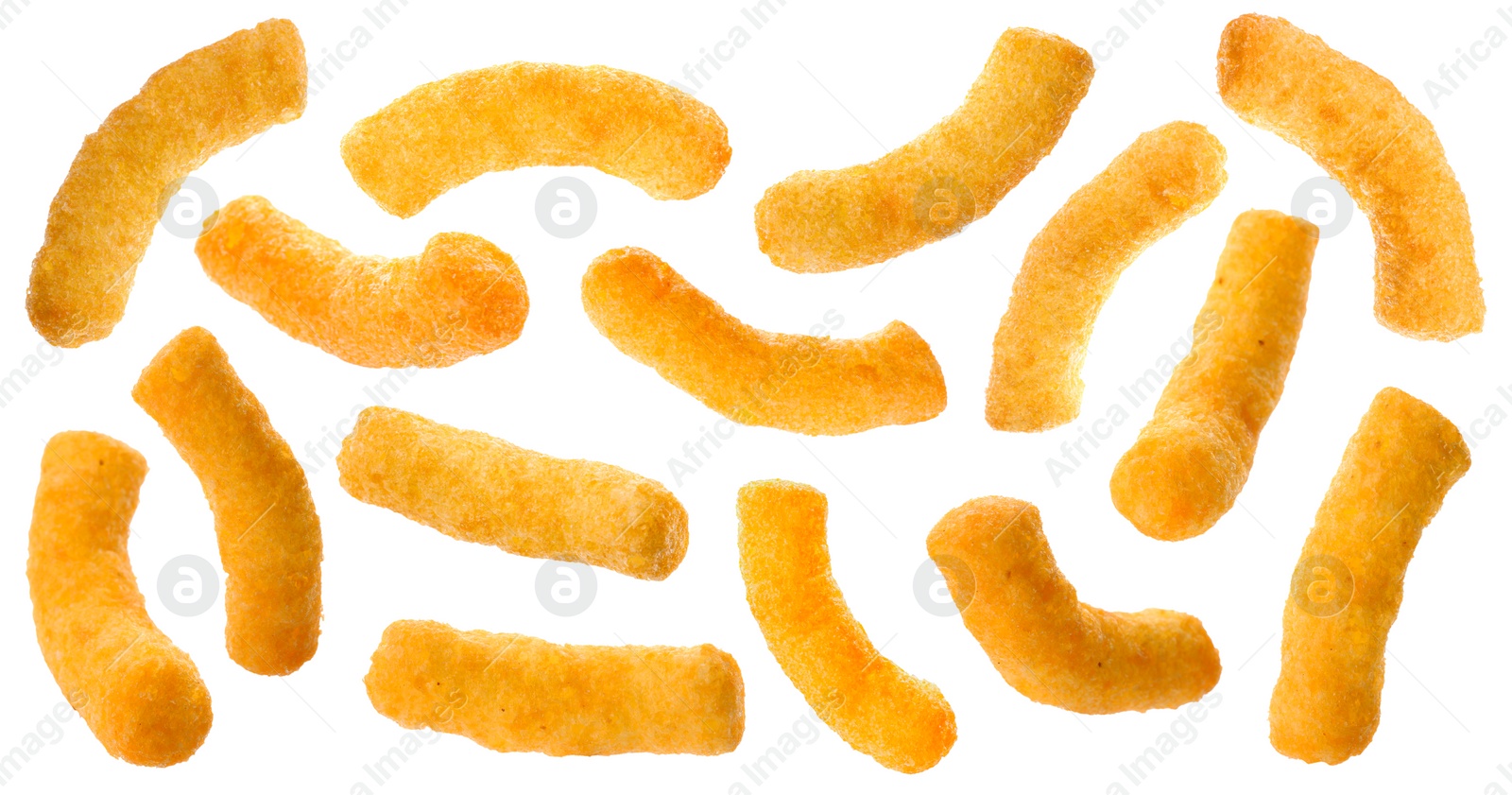 Image of Many tasty corn sticks falling on white background