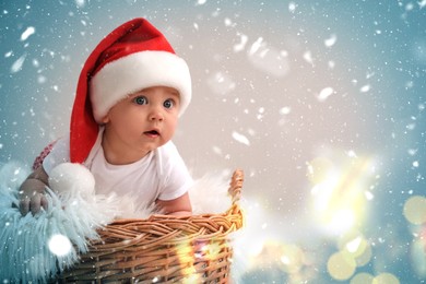 Cute baby in wicker basket on color background, space for text. Christmas celebration