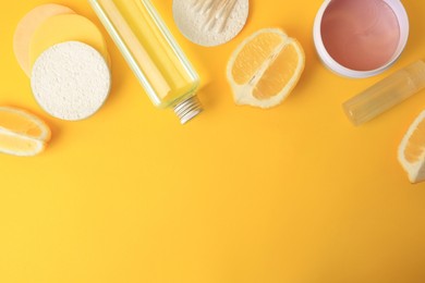 Lemon face cleanser. Fresh citrus fruits and personal care products on yellow background, flat lay with space for text