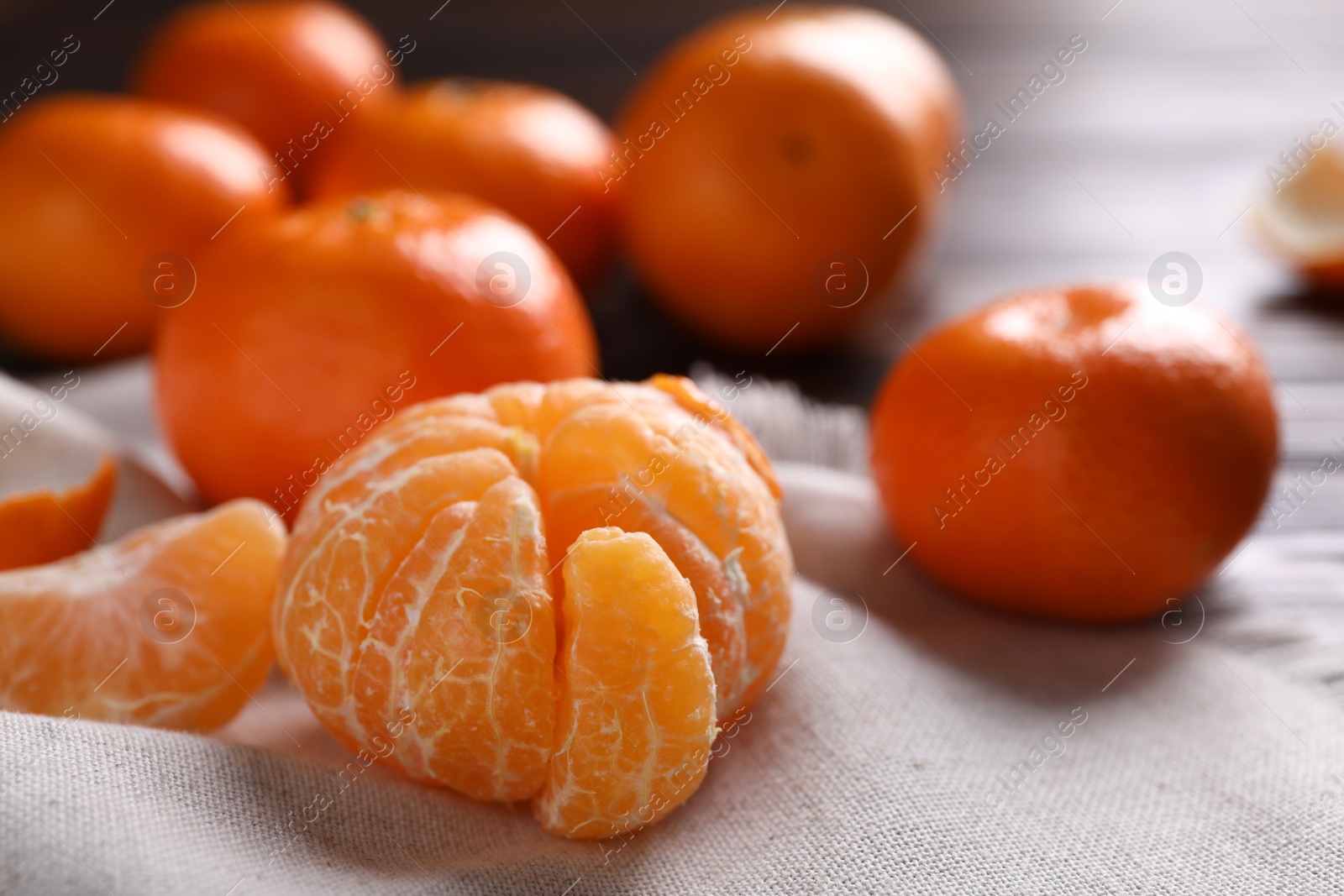 Photo of Fresh ripe tangerine on table, closeup. Citrus fruit