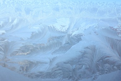 Photo of Beautiful frosty window as background, closeup. Winter morning