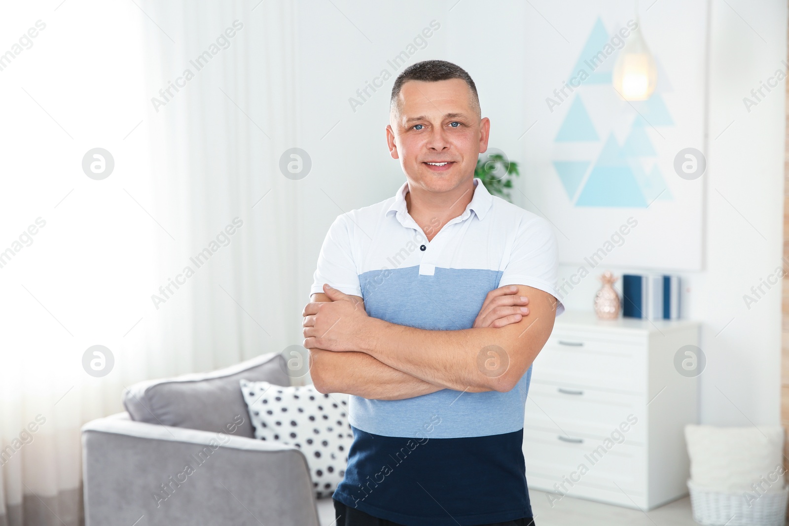 Photo of Portrait of mature man in living room