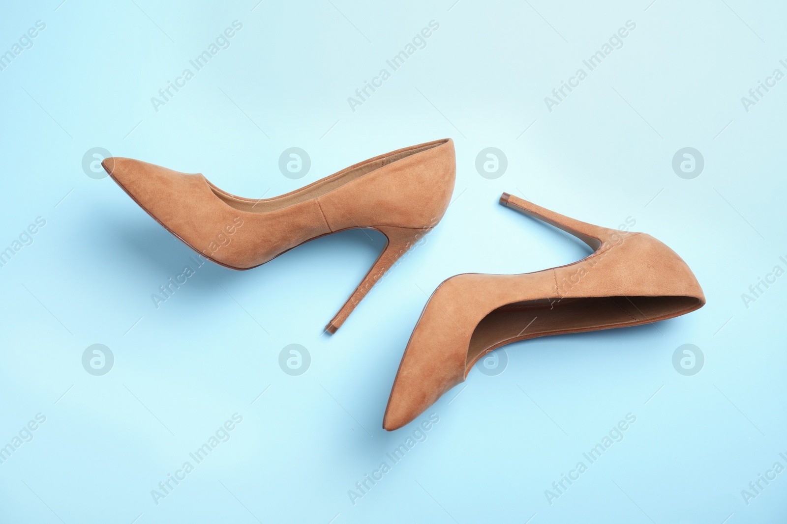 Photo of Pair of beautiful shoes on color background, top view