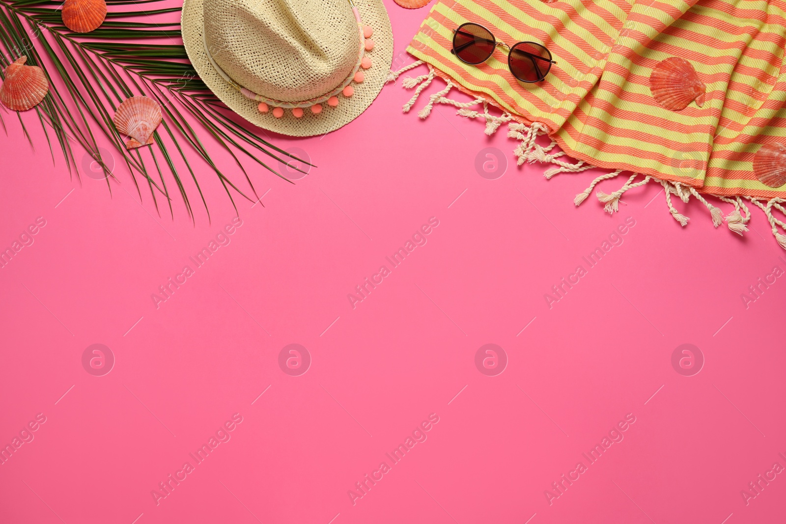 Photo of Flat lay composition with different beach objects on pink background, space for text