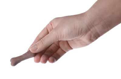 Photo of Woman holding bone shaped dog cookie on white background, closeup