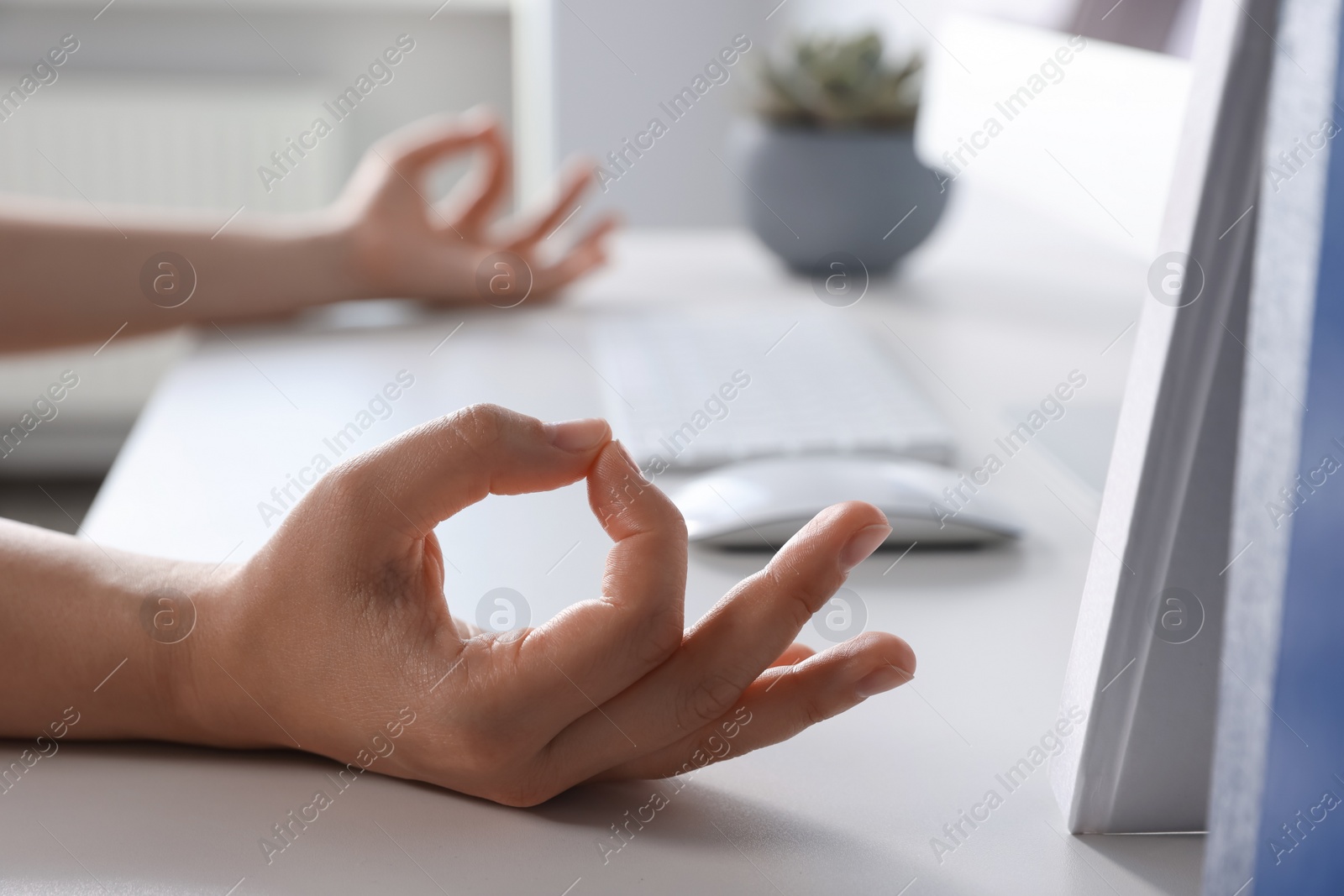 Photo of Find zen. Woman taking break from work at table indoors, closeup