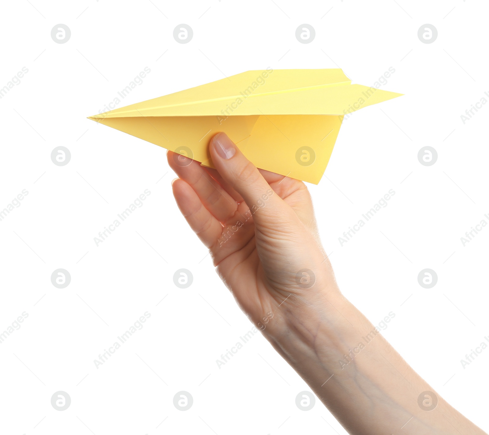 Photo of Woman holding yellow paper plane on white background, closeup