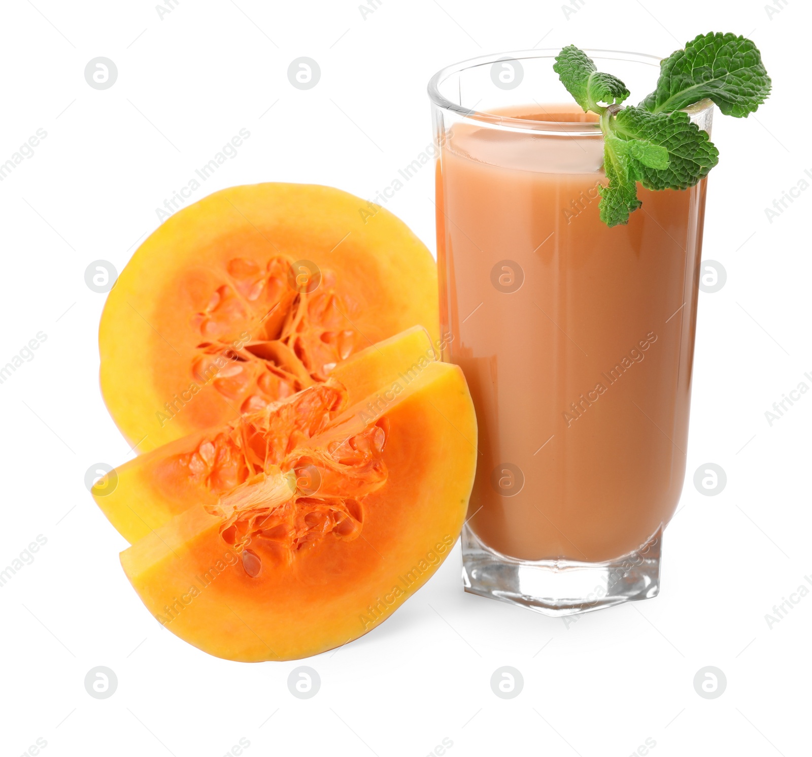 Photo of Glass of pumpkin juice and fresh vegetable with mint leaves on white background