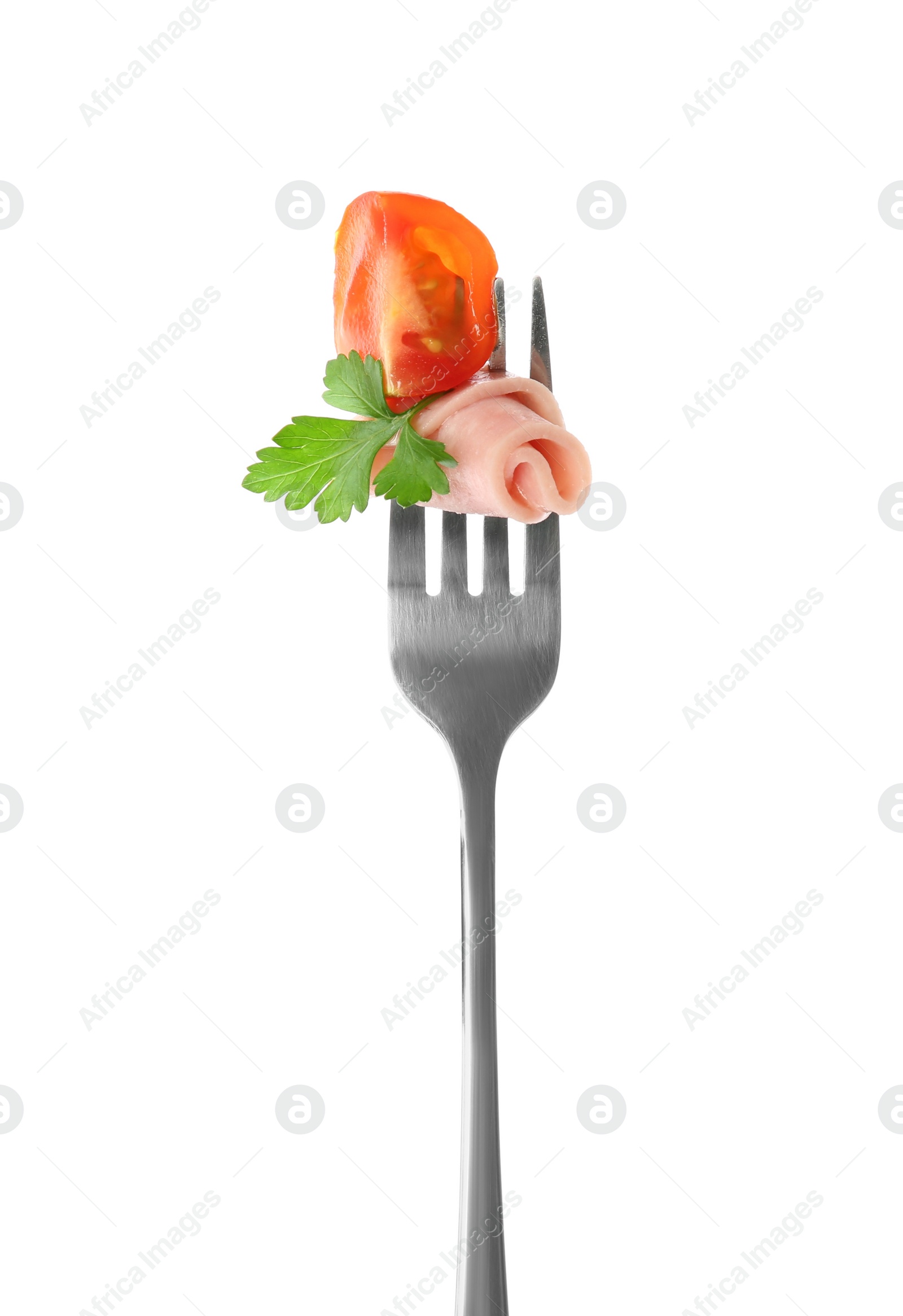 Photo of Fork with tasty slice of ham, tomato and parsley isolated on white