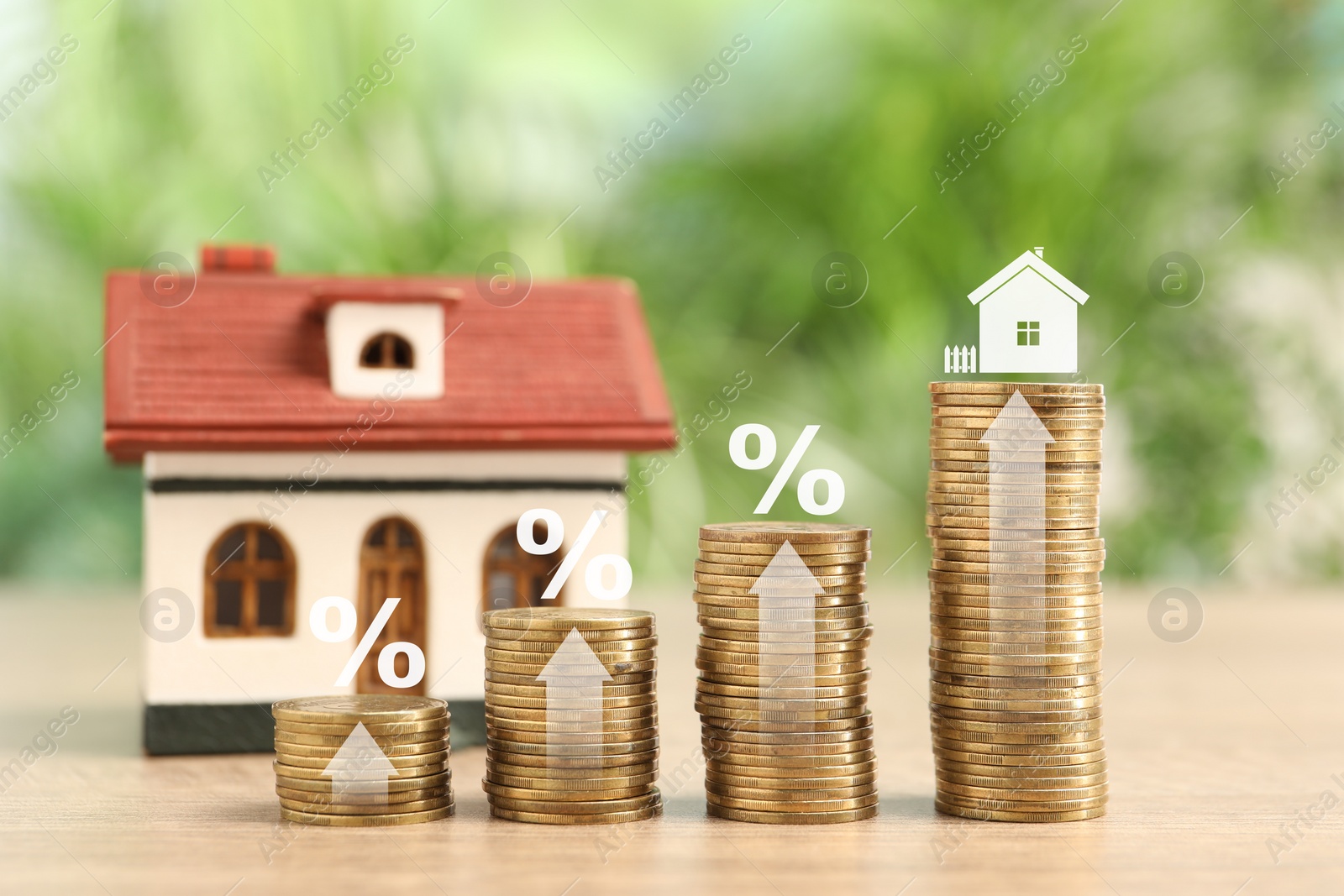 Image of Mortgage rate. Stacked coins, arrows, percent signs and model of house