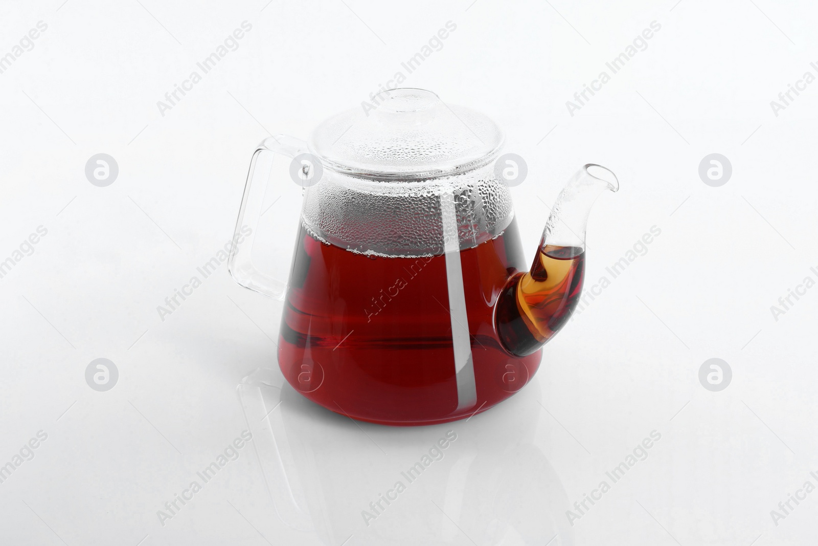 Photo of Tasty tea in teapot on white background