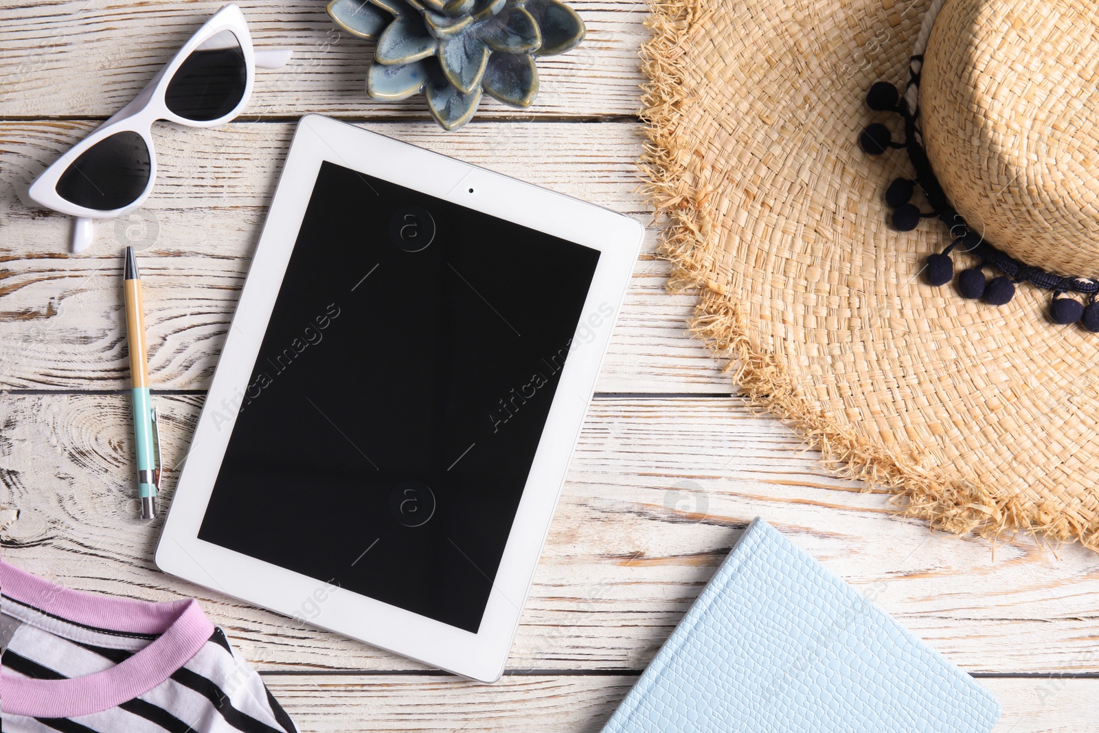 Photo of Flat lay composition with tablet on wooden table, space for text. Blogger's workplace