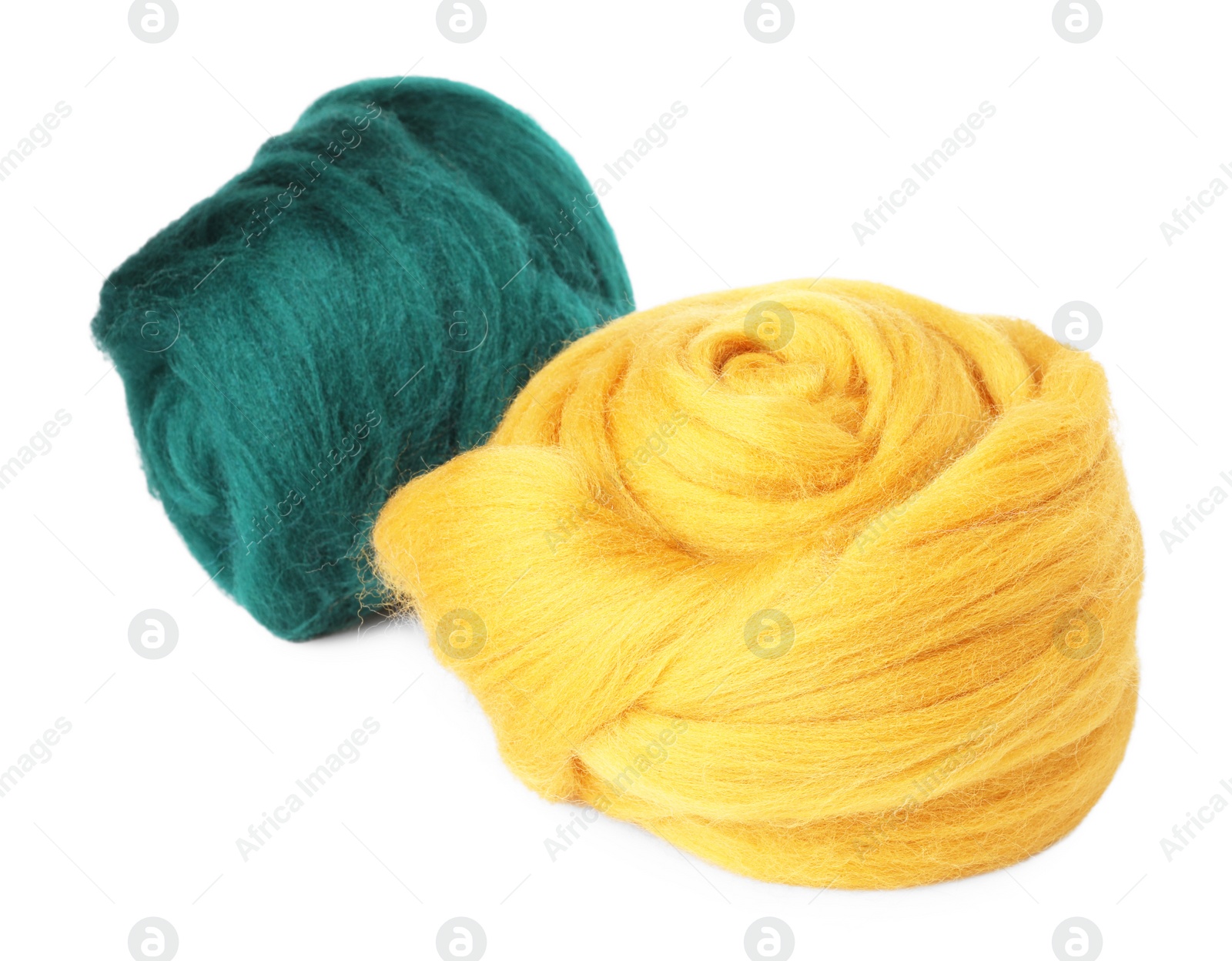Photo of Yellow and green felting wool isolated on white