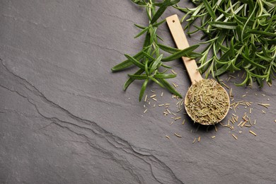 Photo of Fresh and dry rosemary on gray table, above view. Space for text